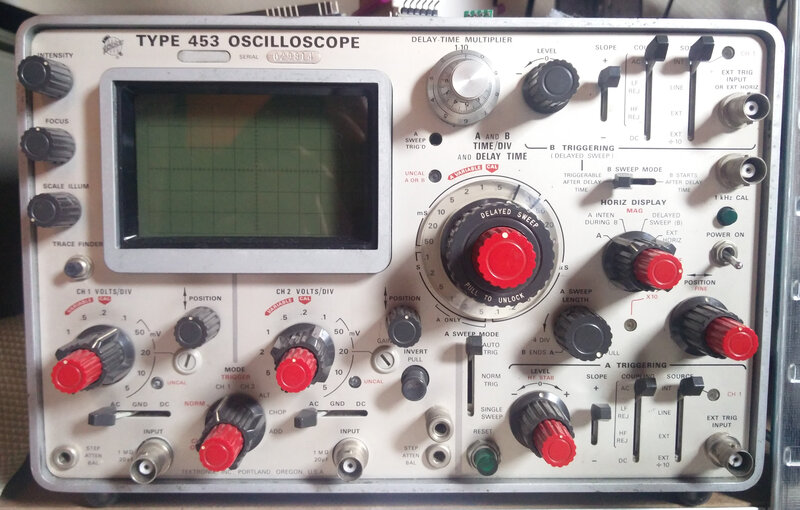 Front panel of the Tektronix type 453 with a characteristic small CRT screen. This scope was released in 1965 being on of the first transistorized oscilloscopes.