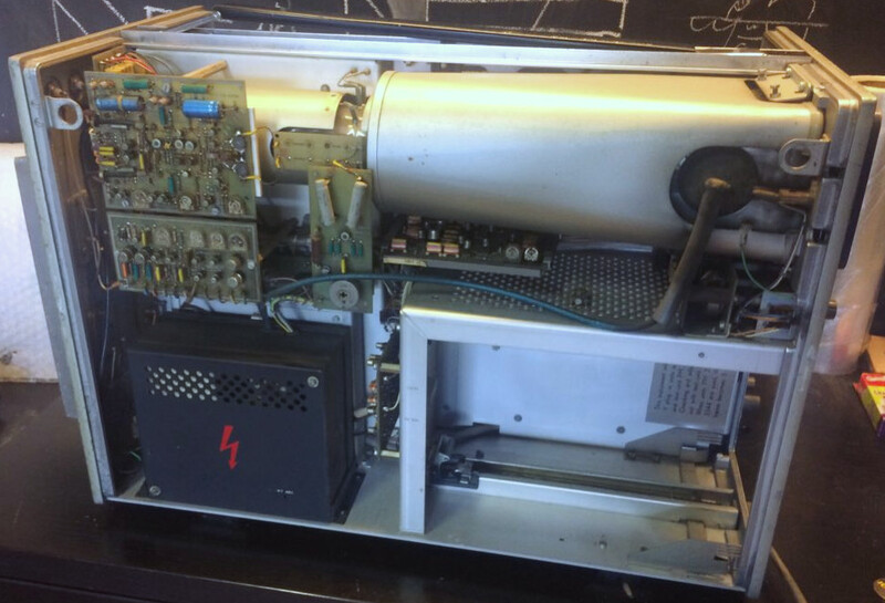 Left side view of the Philips PM 3370 453 analog oscilloscope with the covers removed showing the spacious interior and part of the CRT and drivers.