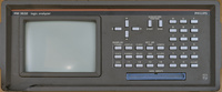 Front panel of the Philips PM3632 Logic Analyzer from 1983 showing its characteristic silver buttons and small green CRT display. The overall shape of the front panel is boxy. The lower left corner of the bezel is broken and damaged. This unit is not functional and used for spare parts.