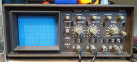 Front panel of the Philips PM 3206 analog oscilloscope. Driven mostly by knobs and essentially no user interface on the CRT screen. Being released in 1986 this oscilloscope just slightly predates the transition to on screen user interface driven equipment.