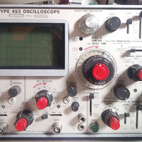 Front panel of the Tektronix type 453 with a characteristic small CRT screen. This scope was released in 1965 being on of the first transistorized oscilloscopes.