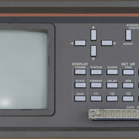 Front panel of the Philips PM3632 logic analyzer from 1983. This front panel is in good condition having little wear. The front panel features characteristic silver buttons and a boxy shape. The color of the CRT is bright green.